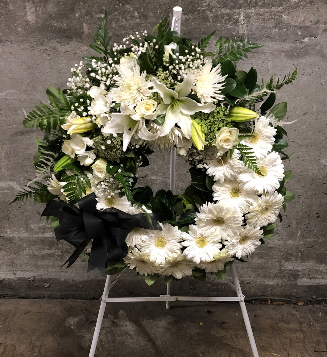 Classical white funeral wreath